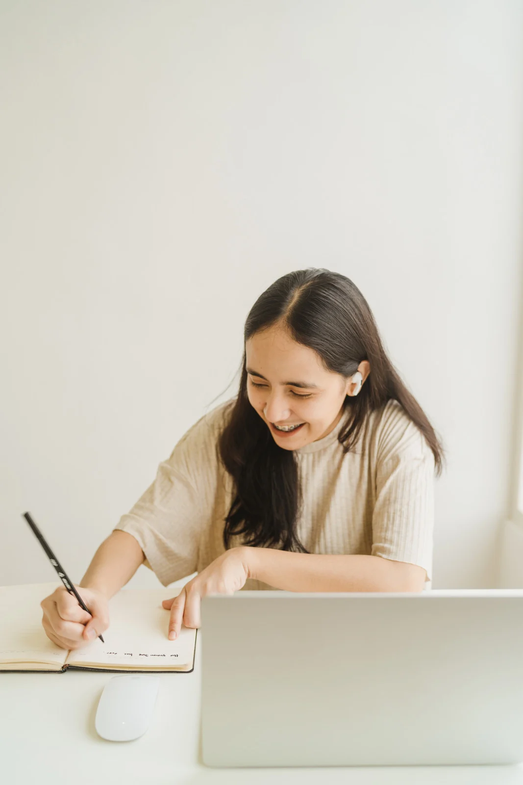 Woman journaling in a calm, reflective moment.